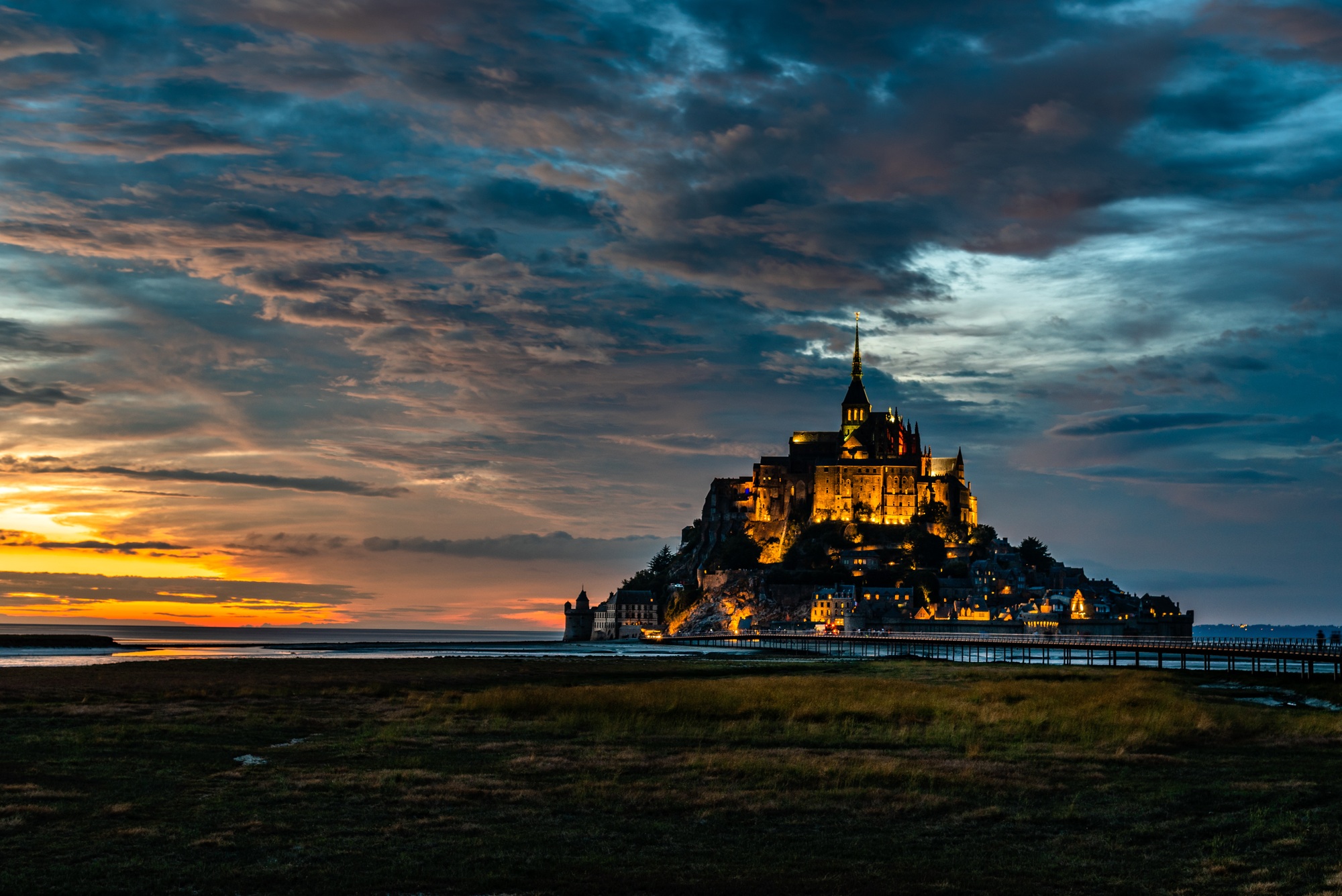Dramatic sunset on Mont Saint Michel, Normandy Dramatic sunset on Mont Saint Michel, Normandy